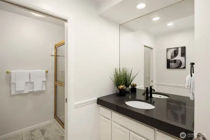 Adjacent three quarter bath with new LVT flooring