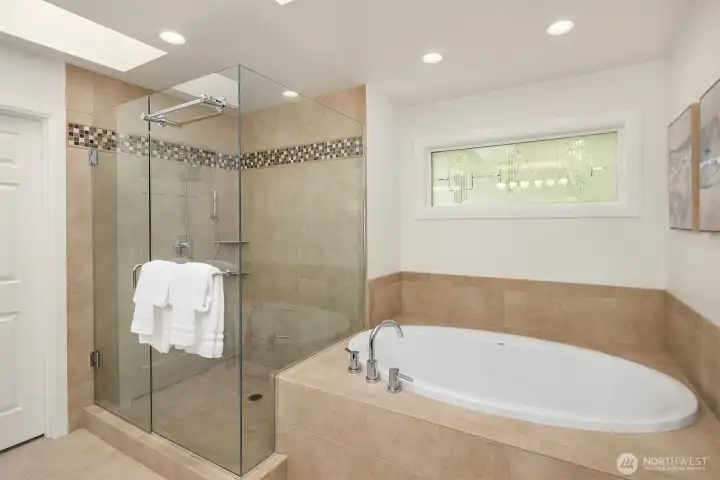 Updated walk-in shower enclosure and soaking tub