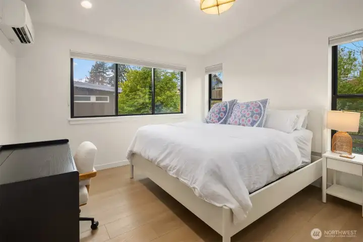 Upstairs, cathedral ceilings elevate the space, featuring three bedrooms and two beautifully appointed baths—both with heated floors—plus a bright, well-positioned laundry room. Enjoy year-round comfort with ductless mini-splits in every room, offering both heating and cooling. Upstairs, cathedral ceilings elevate the space, featuring three bedrooms and two beautifully appointed baths—both with heated floors—plus a bright, well-positioned laundry room. Enjoy year-round comfort with ductless mini-splits in every room, offering both heating and cooling.