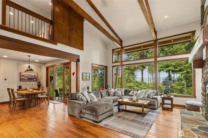 Soaring ceilings, dramatic exposed beams, and rich hardwoods come together with breathtaking mountain views to create a spectacular welcome to this extraordinary home.