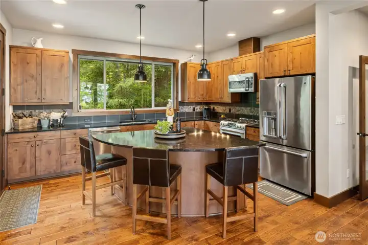 The kitchen island is the true gathering spot, a place where family and friends connect.