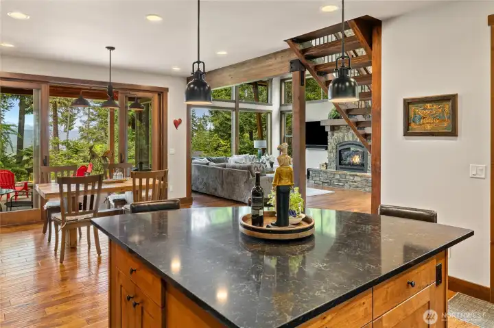 The home is truly situated to enjoy the views from the main living areas, i.e. the kitchen, dining, and living room! This description highlights the property's prime location and desirable features, emphasizing how the layout enhances the enjoyment of scenic views from the most frequently used living spaces.