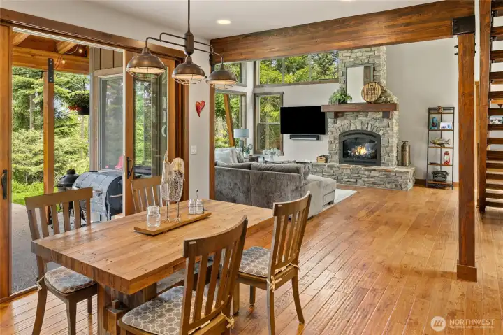 Double doors off the dining area open to a covered patio, seamlessly extending the living space to the inviting south side of the home.