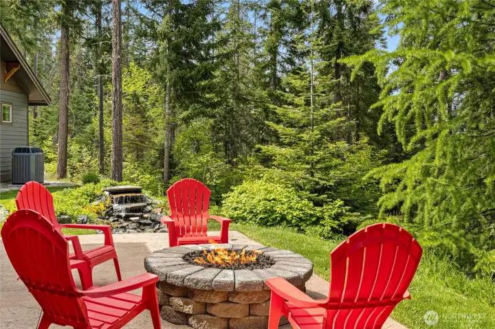 Gather around the built-in gas firepit on the patio and be mesmerized by the mountain views and the trickling of the water feature.