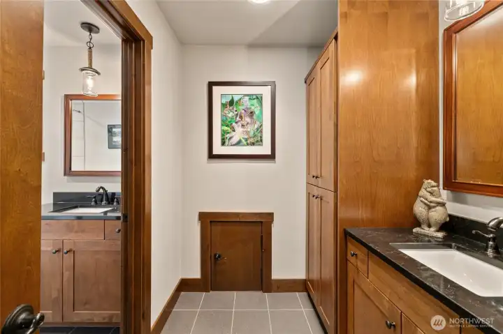 The shared bathroom located on the upper level features a secondary sink area, designed to facilitate simultaneous use and enhance the overall sense of privacy for all occupants.