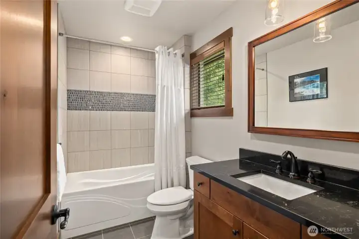 The upper level shared bath.