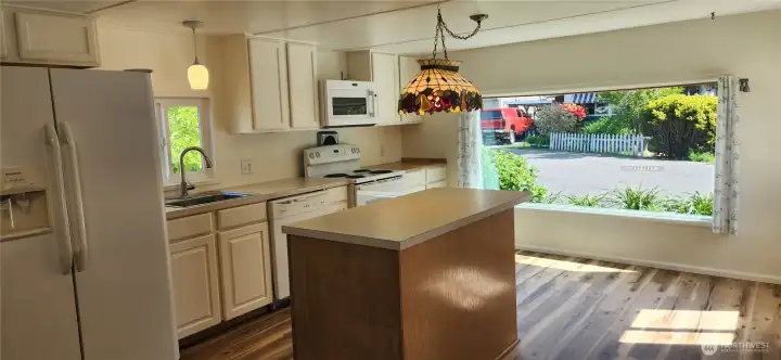 Generous kitchen offers a large island and lots of cabinetry for great storage. Generous kitchen offers a large island and lots of cabinetry for great storage.