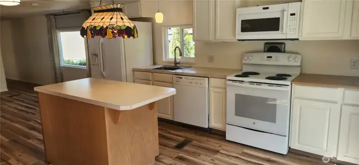 There is also space to pull up a couple bar stools at the island. Ample space for more than one cook in the kitchen. There is also space to pull up a couple bar stools at the island. Ample space for more than one cook in the kitchen.