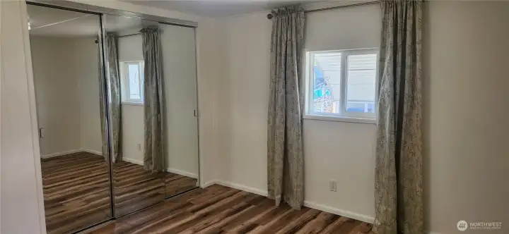 Primary bedroom with large closet and window awnings to provide privacy. Primary bedroom with large closet and window awnings to provide privacy.