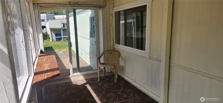 Front porch is covered and enclosed with sliding doors to your patio and access to your carport. Front porch is covered and enclosed with sliding doors to your patio and access to your carport.