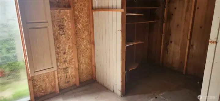 Another view of the first shed. The cabinet door hides an ironing board. Another view of the first shed. The cabinet door hides an ironing board.