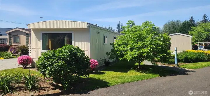 Highly desired corner lot with private walkway to your backdoor and yes, more gardens to enjoy. Highly desired corner lot with private walkway to your backdoor and yes, more gardens to enjoy.