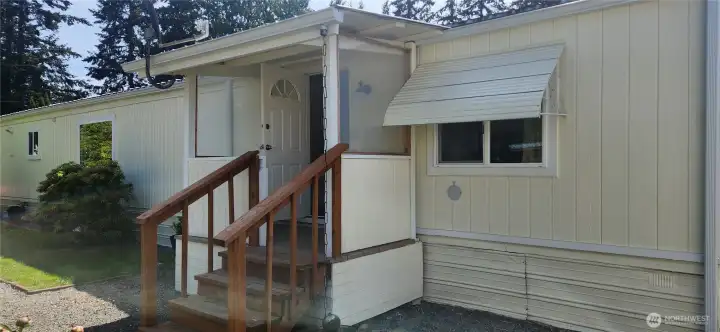 Covered back porch gives another access option to the home. Covered back porch gives another access option to the home.