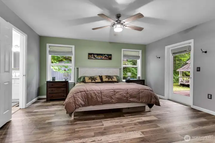 Another view of the large primary suite. The walk-in closet is to the left of this photo.