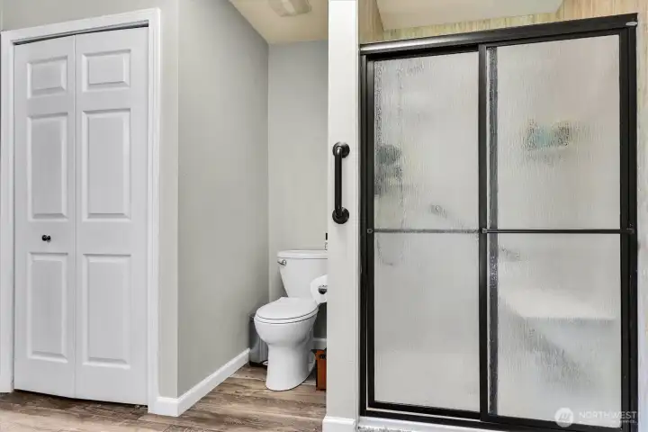 Primary bath has a separate shower and soaking tub and also has its own linen closet.