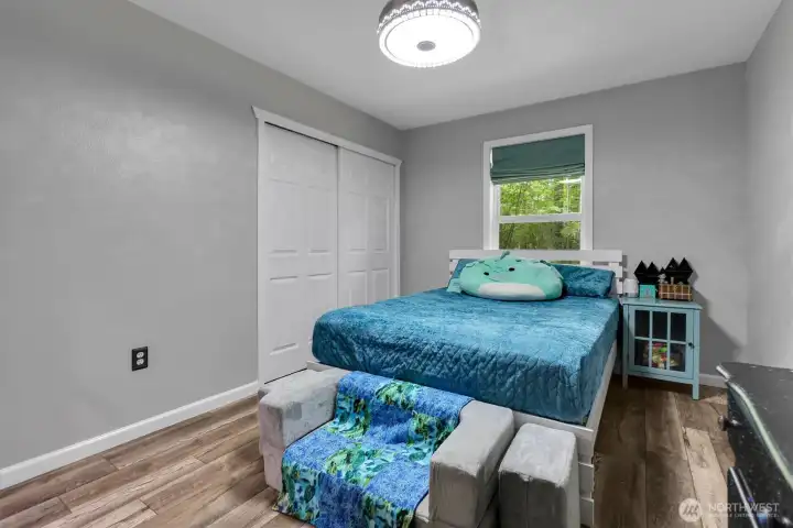 One of the three main floor bedrooms.