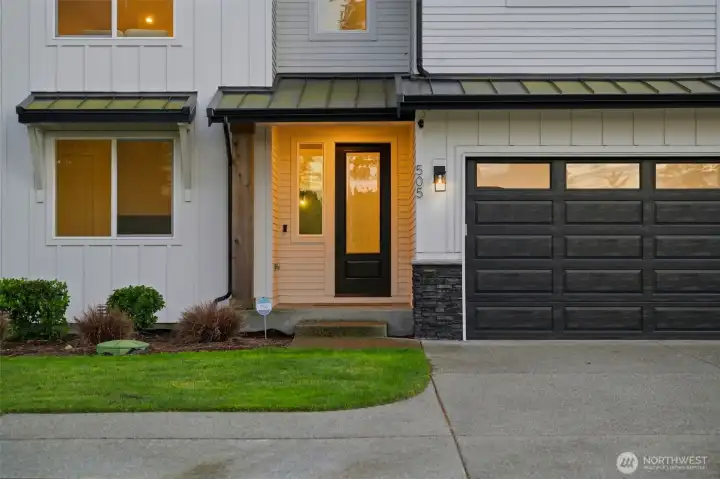 Welcoming covered entry with stacked stone accents, board-and-batten siding, and a striking front door — true Modern Farmhouse Craftsman curb appeal. Welcoming covered entry with stacked stone accents, board-and-batten siding, and a striking front door — true Modern Farmhouse Craftsman curb appeal.