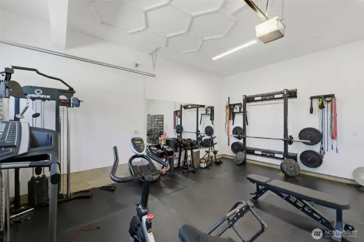 One of the 4-car garage bays transformed into a private home gym — endless possibilities for this flexible space. One of the 4-car garage bays transformed into a private home gym — endless possibilities for this flexible space.