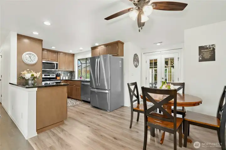Kitchen/Dining area #1 has great flow and easy access to patio.