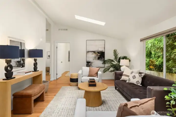 The family room with light streaming in from the skylights. The family room with light streaming in from the skylights.
