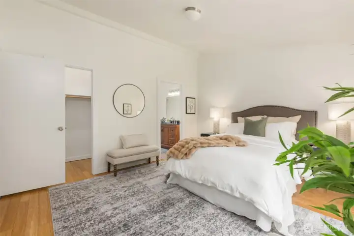 The primary suite with its walk-in closet. The ensuite is to the right. The primary suite with its walk-in closet. The ensuite is to the right.
