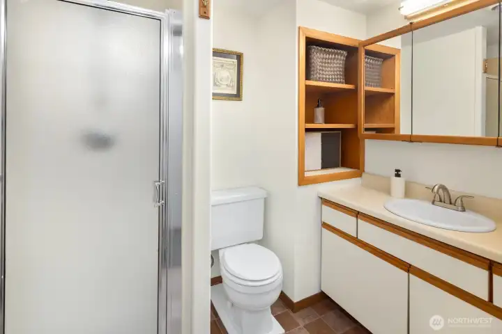 A three-quarter bathroom with additional storage completes the lower residence with convenience and functionality.