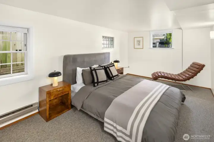 A second oversized bedroom offers comfortable accommodations for family, guests, or future tenants.
