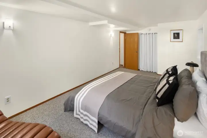Well-proportioned rooms throughout the lower residence provide flexibility for a variety of living arrangements. (Wood, louvered closet doors available/included in both lower bedrooms if desired.)