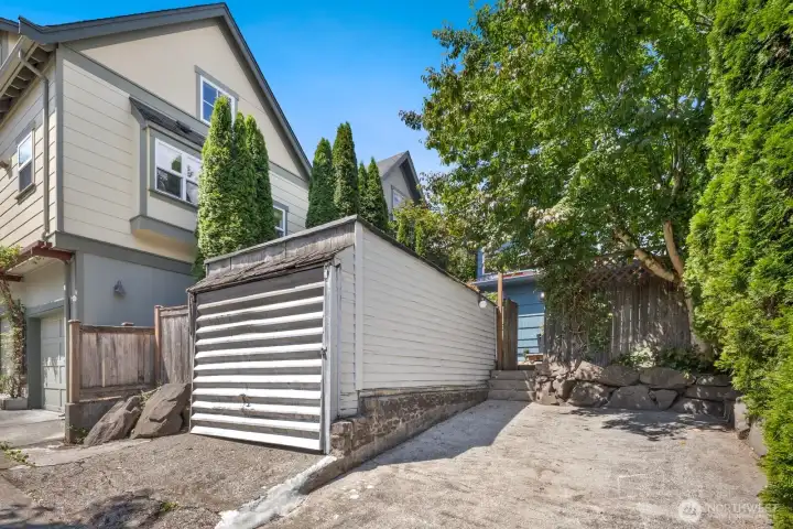 Rare off-street parking here includes a detached garage and a parking pad offering flexibility in the heart of the city.