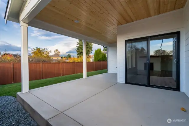 Covered patio and fenced backyard. Pics are of a different 1785 plan. Features and colors may differ.