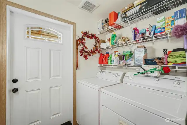 Laundry room with access to the incredible yard.