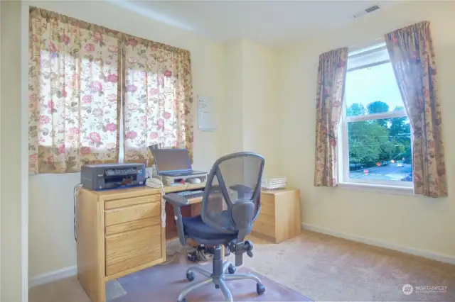 Second bedroom at the front of the house, presently used as an office. Notice two windows for light.