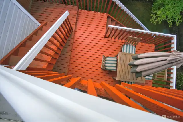 View looking down to deck off kitchen  from upper level deck.