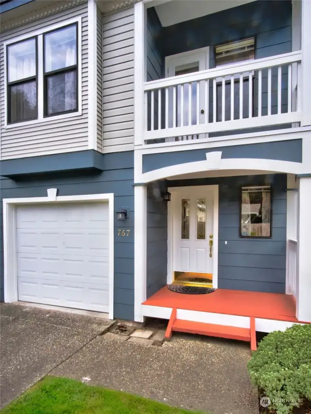 Your front door and private two car tantum garage. Notice deck off the living room.