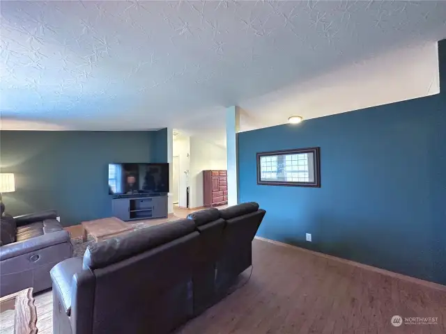 Partial wall separates Living Room & Kitchen