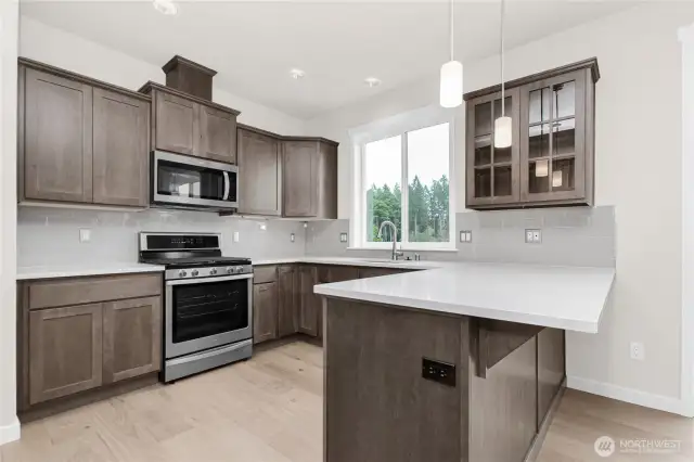 Canyon Creek Cabinets Maple cabinetry with   full extension guides and soft close drawers. Photo for illustration only, not actual.