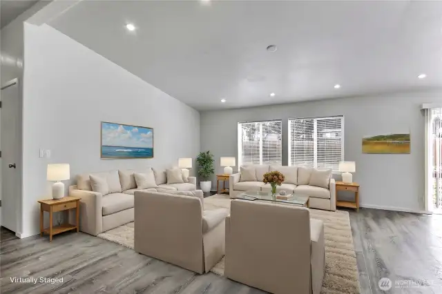 Living room with vaulted ceiling and
