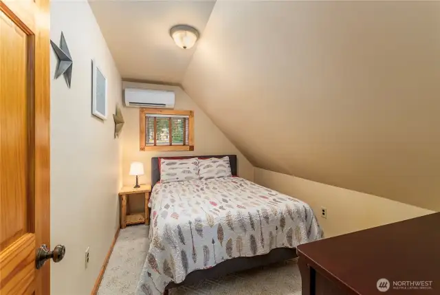 Upstairs Private Enclosed Bedroom    Enjoy privacy and comfort in this upstairs bedroom, featuring a Queen-sized bed, Mini-Split HVAC, and a dresser—your personal retreat.