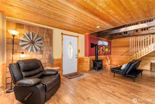 Inviting Front Entry with Character    Step into a warm, cozy atmosphere with hardwood floors and exquisite tongue-and-groove wood accents that greet you as you enter.