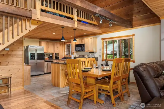 Elegant Dining Space for Six    Enjoy meals around a solid wood dining table with comfortable seating for six. Tiled floors offer easy maintenance while complementing the room's inviting style.