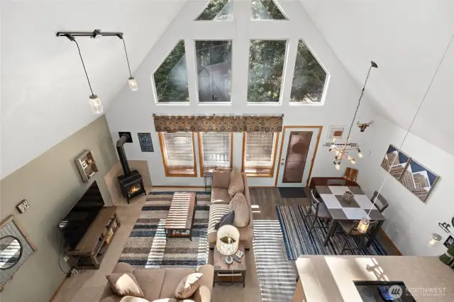 Classic cabin styling with soaring ceilings and open concept living space.