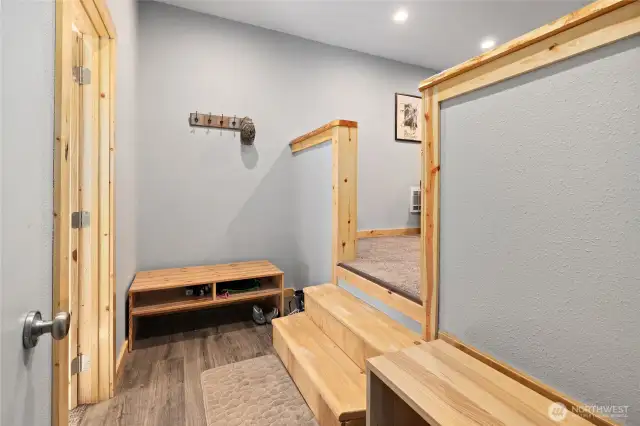 Drop your boots and jackets in this entryway off of the one car garage.