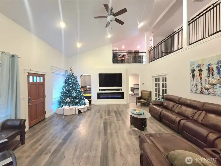 Living room and loft, past the TV is the Kitchen