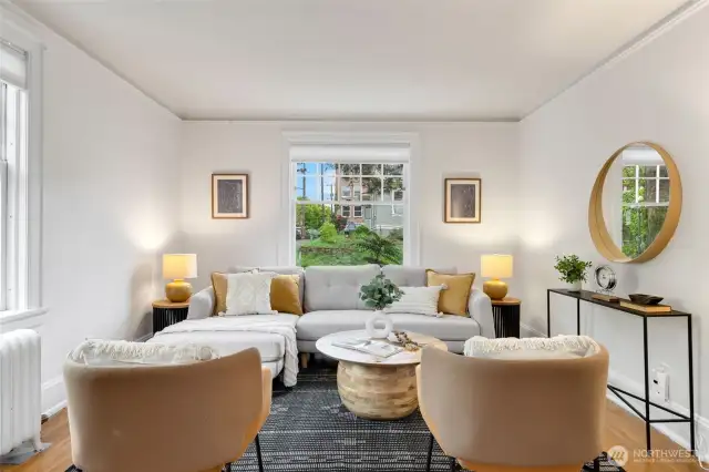 Gracious and spacious living room that glows with natural light from 2 sides in