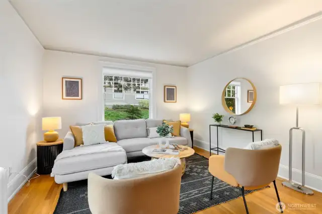 Gracious and spacious living room that glows with natural light from 2 sides in