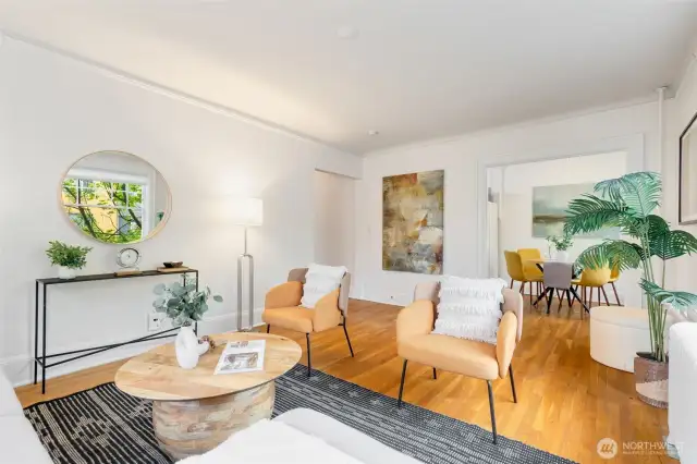 Gracious and spacious living room that glows with natural light from 2 sides in