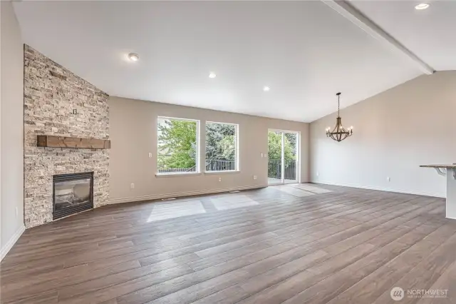 nice open concept with lvp flooring and propane fireplace