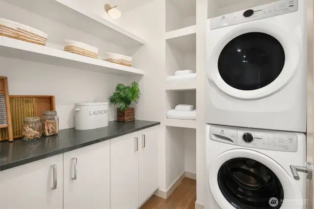 . Laundry Room with Custom Cabinetry and Shelves- Washer and Dryer Provided