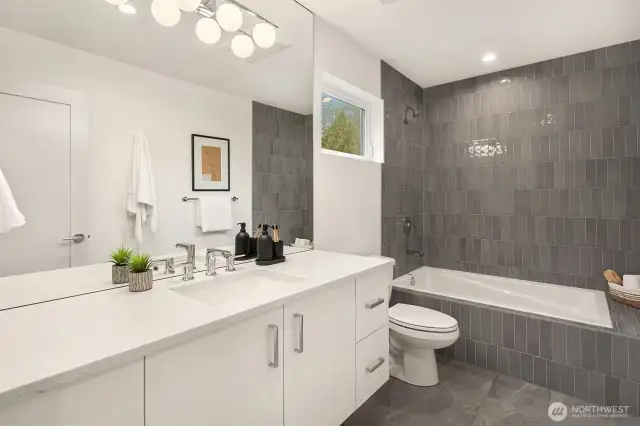 Guest Bathroom with Drop-in Tub, Tile Surround and Floating Vanity