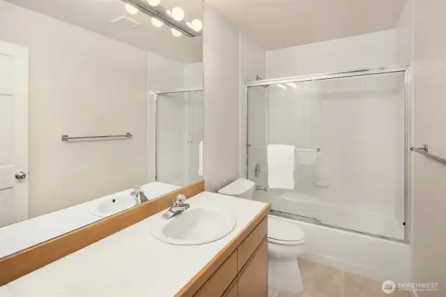 Full bathroom outside second bedroom.